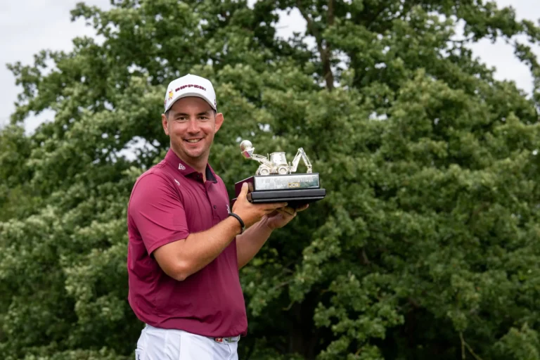 First place individual champion Lucas Herbert of Ripper GC poses for a photograph following the final round of LIV Golf United Kingdom presented by JCB at JCB Golf & Country Club