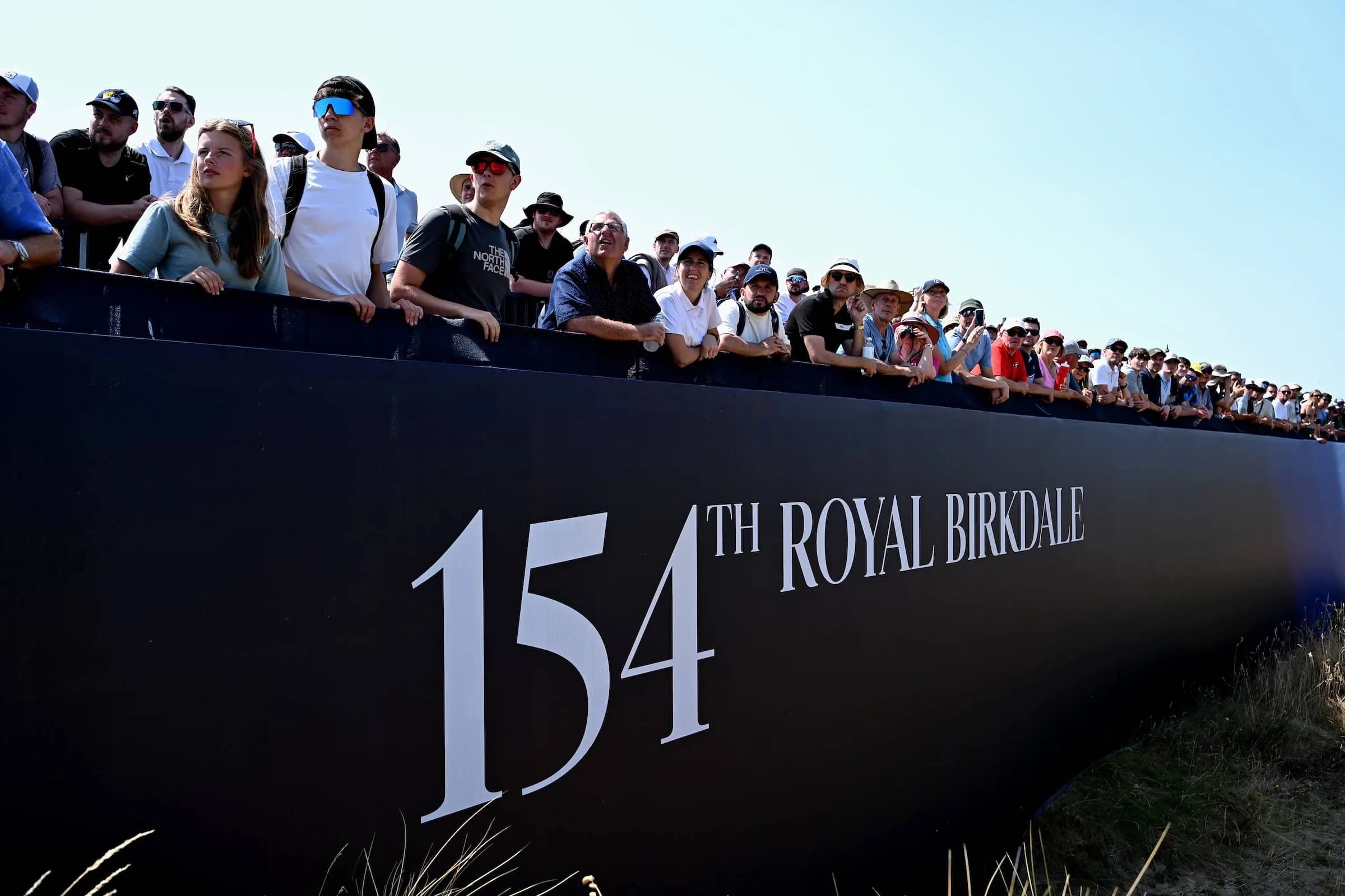 Spectators look on during a practice round prior to The 154th Open Championship at Royal Birkdale.