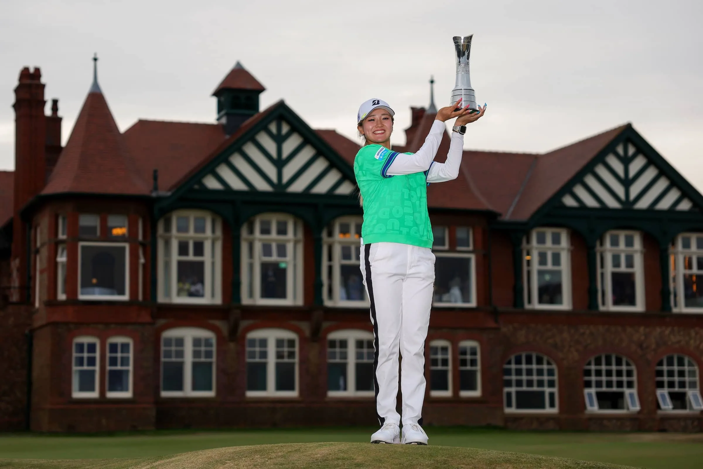 Shino Kuwaki of Japan poses with the trophy following victory of the AIG Women's Open following the Final Round of the AIG Women's Open 2026