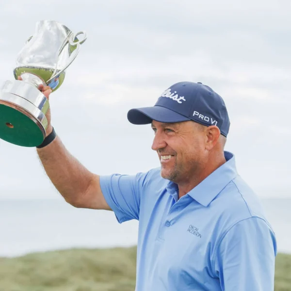 Darren Fichardt celebrates with the Staysure PGA Seniors Championship trophy