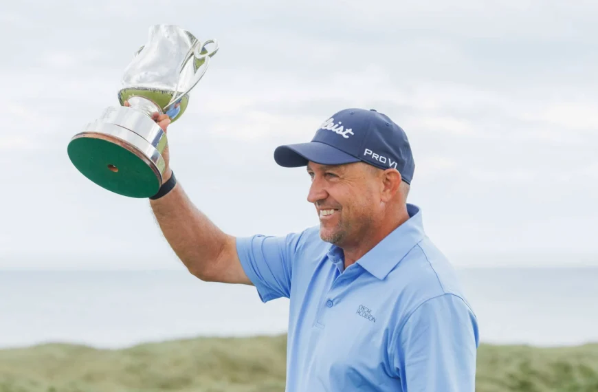 Darren Fichardt celebrates with the Staysure PGA Seniors Championship trophy