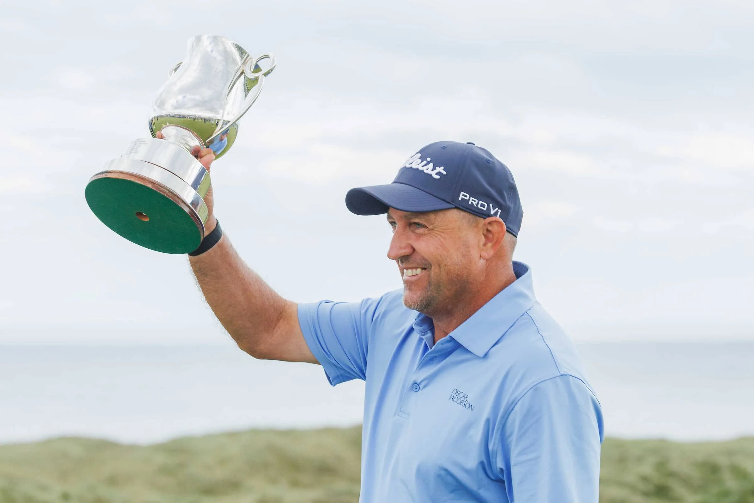 Darren Fichardt celebrates with the Staysure PGA Seniors Championship trophy