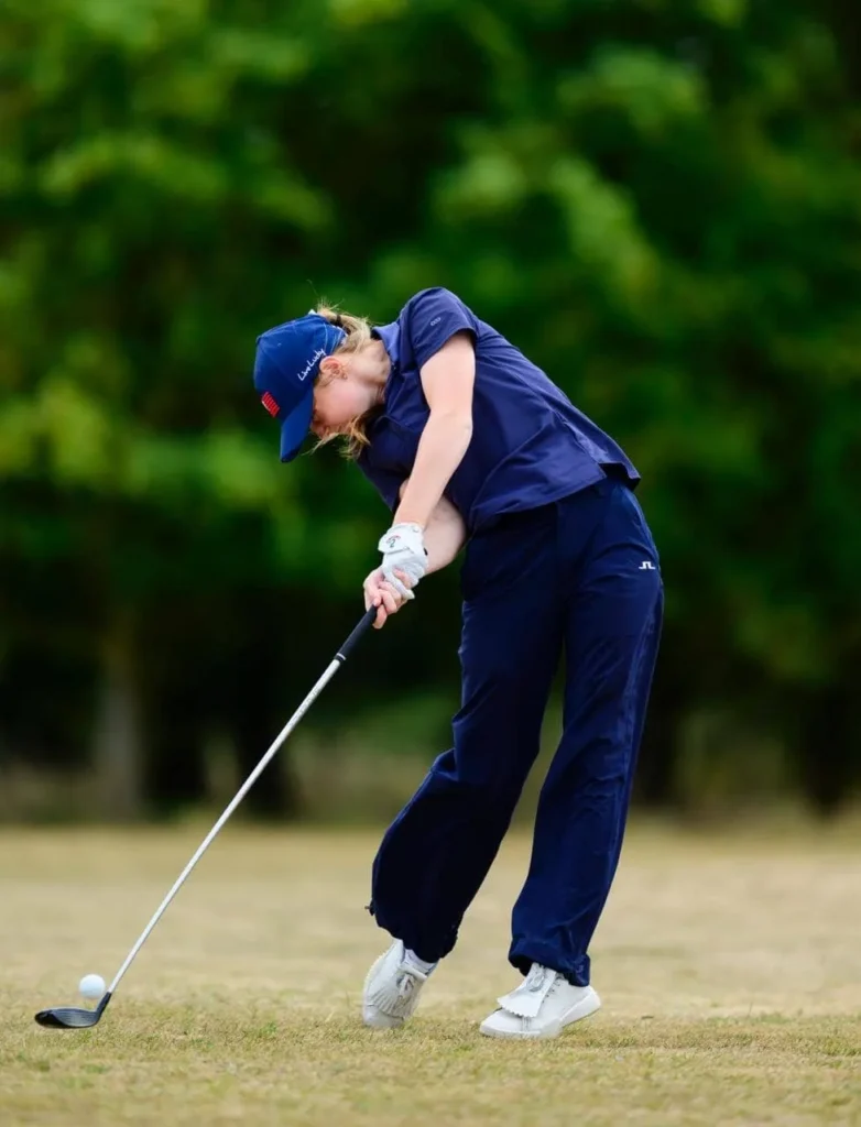 Maybel Brooks hits her fairway wood
