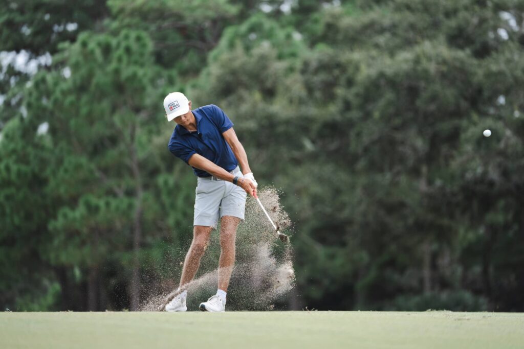Charlie Woods On Course with Iron