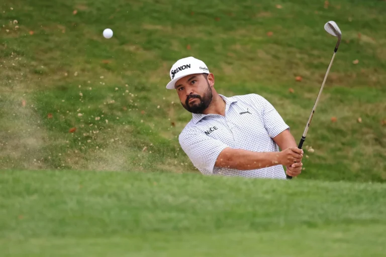 JJ Spaun hits his shot out of the bunker
