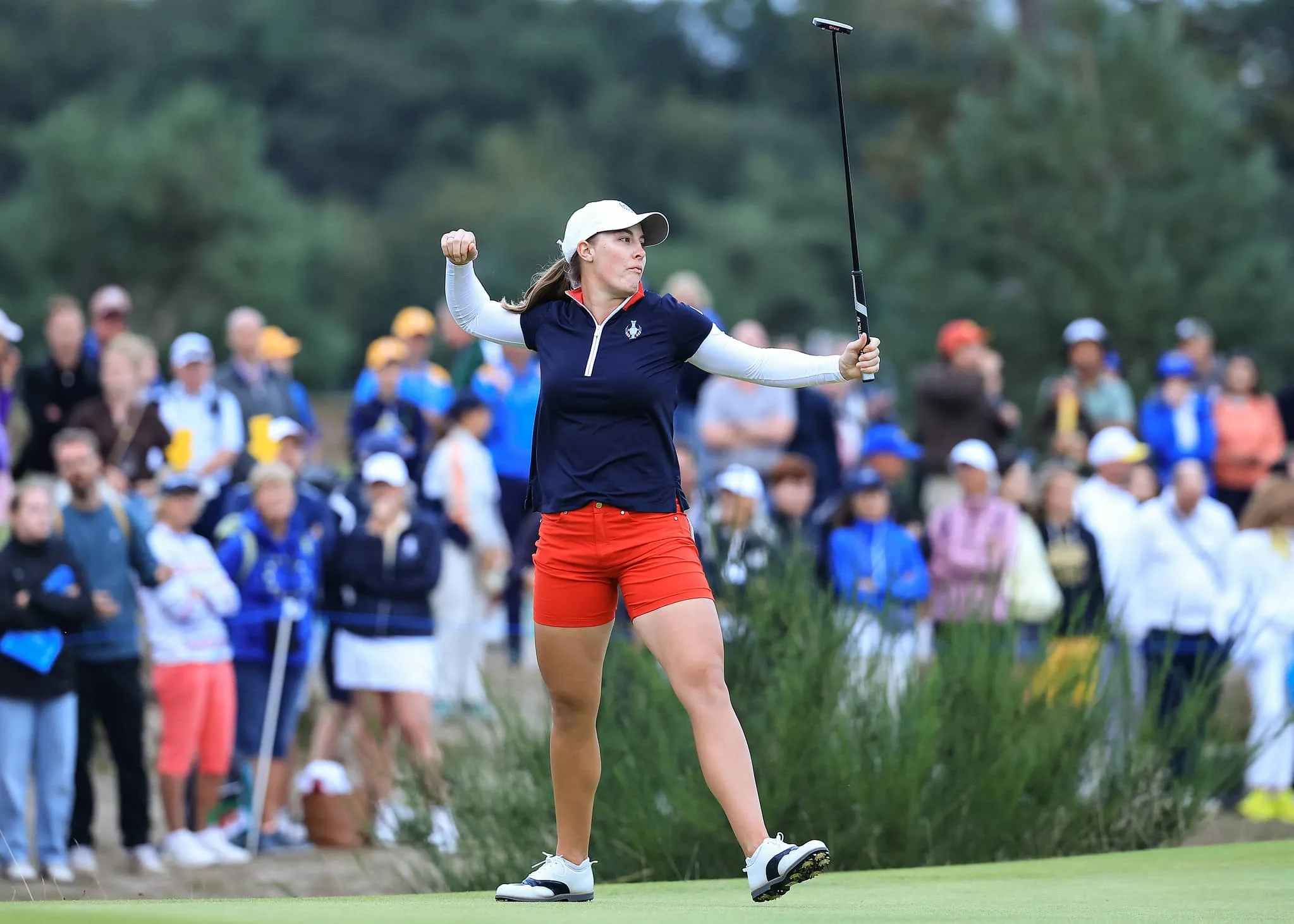 Jennifer Kupcho of The United States team holes a match winning birdie putt on the 18th green