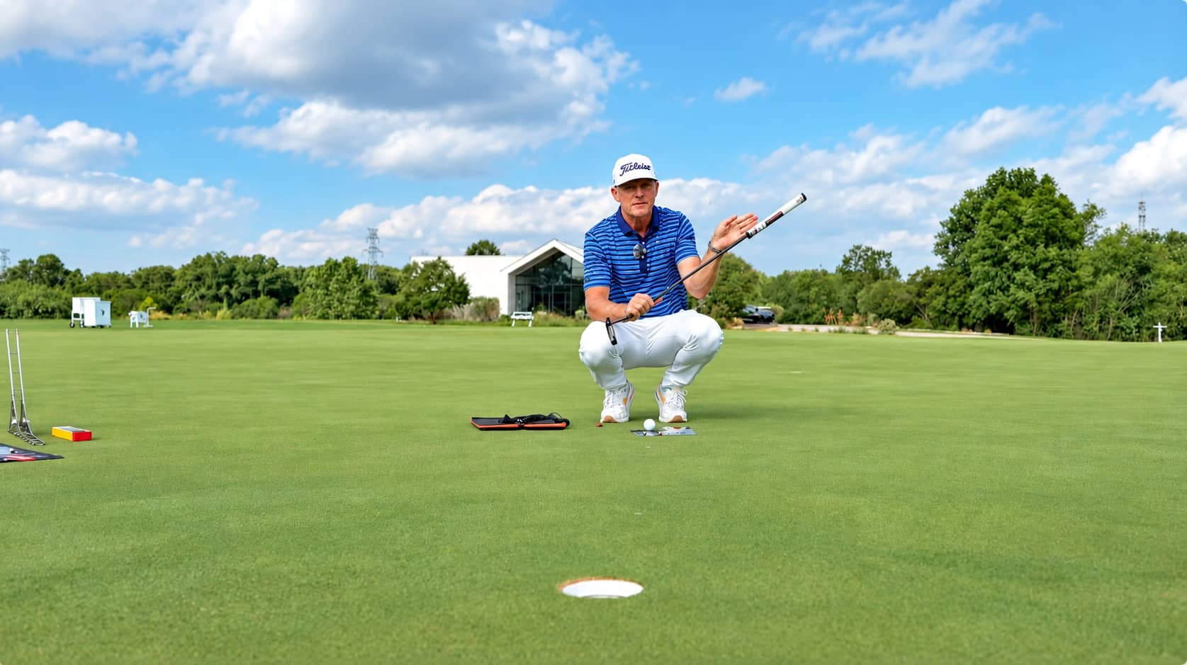 Jordan Spieth's coach Cameron McCormick Lines up for a putt